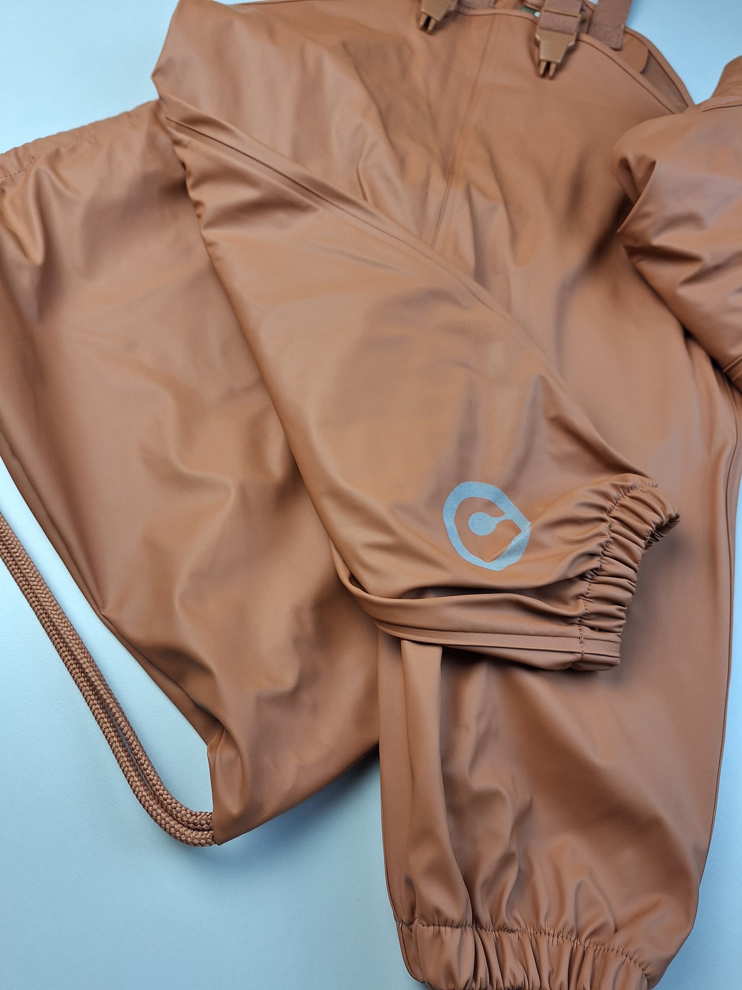 Světle hnědá souprava do deště - kalhoty, bunda, vak